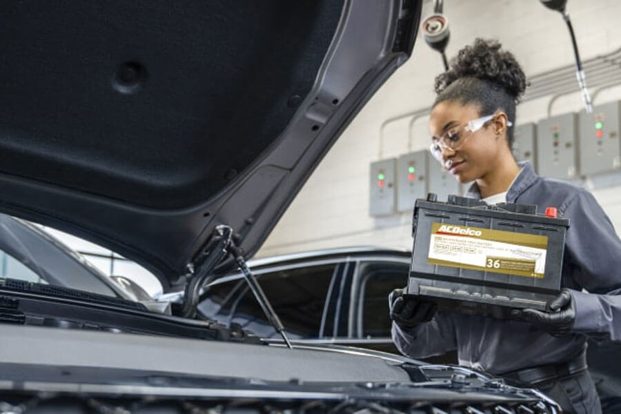 Woman Replacing Car Battery