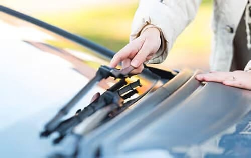 Man Adjusting Windsheild Wipers
