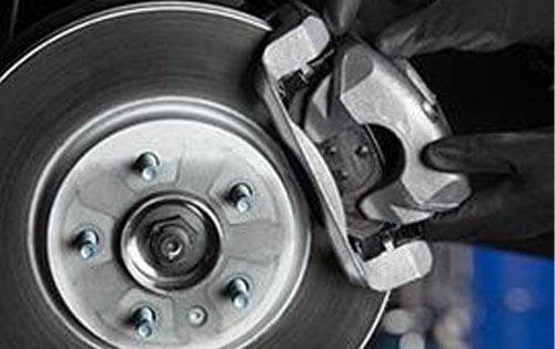 Man Checking Brakes