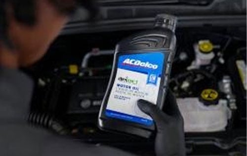 Man Holding Car Oil Container