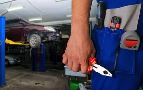 Man's Hand Holding Pliers